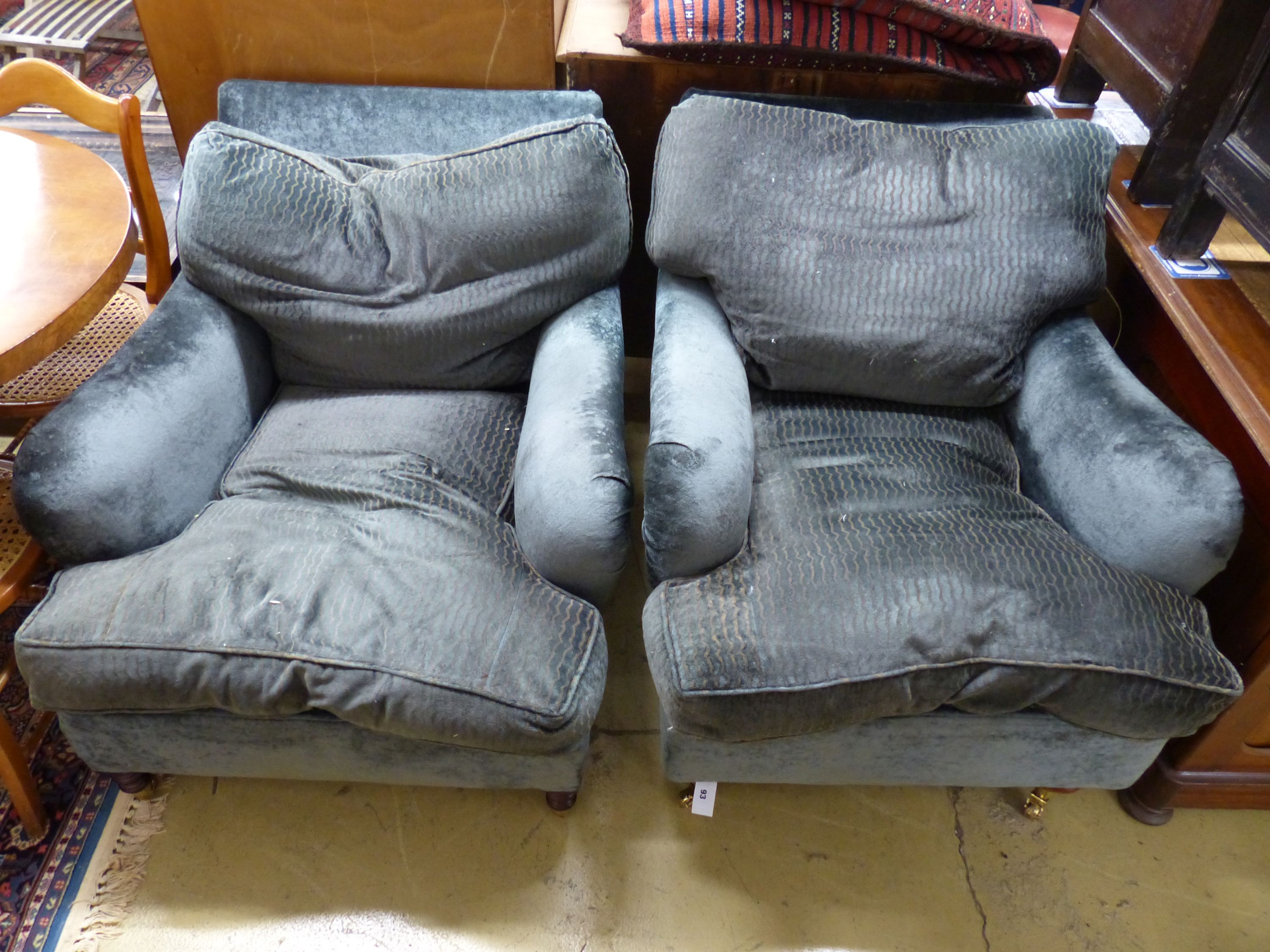 Two George Smith club armchairs in matching upholstery